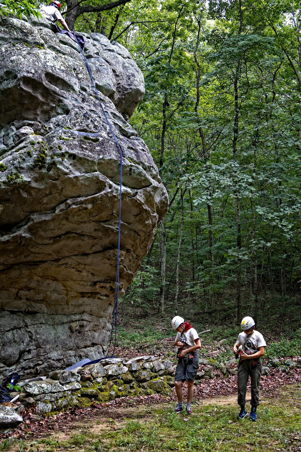A scout climbing at the crag